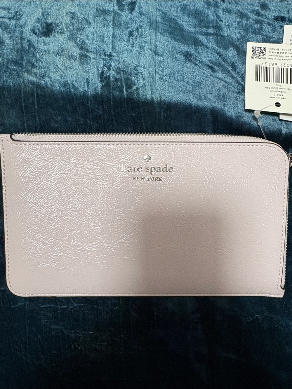 kate spade pale pink glossy zip-around wristlet